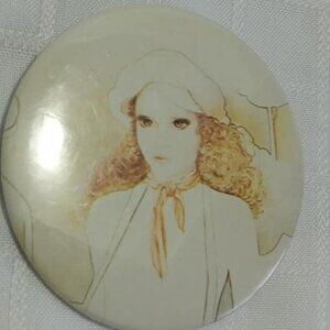 Strange & unusual vintage button pin featuring an art drawing